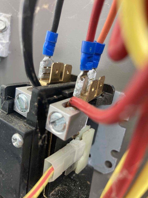 Responded to no cooling complaint on residential air conditioning system. Upon inspection, discovered failed blower motor capacitor preventing proper airflow through the evaporator coil. Tested electrical connections at the terminal block and confirmed voltage readings using digital multimeter. Replaced defective capacitor, verified proper motor operation, and restored system to normal cooling function.