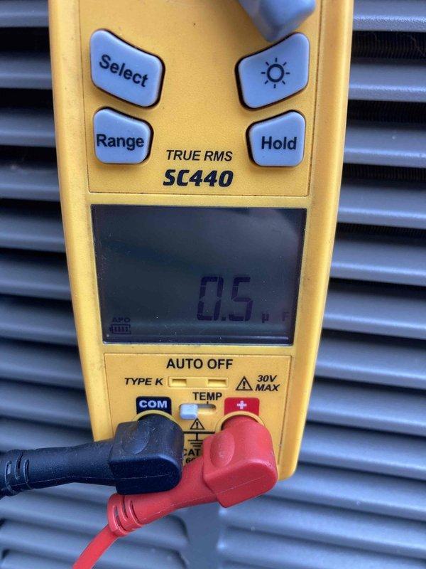 Responded to no cooling complaint on residential air conditioning system. Upon inspection, discovered failed blower motor capacitor preventing proper airflow through the evaporator coil. Tested electrical connections at the terminal block and confirmed voltage readings using digital multimeter. Replaced defective capacitor, verified proper motor operation, and restored system to normal cooling function.