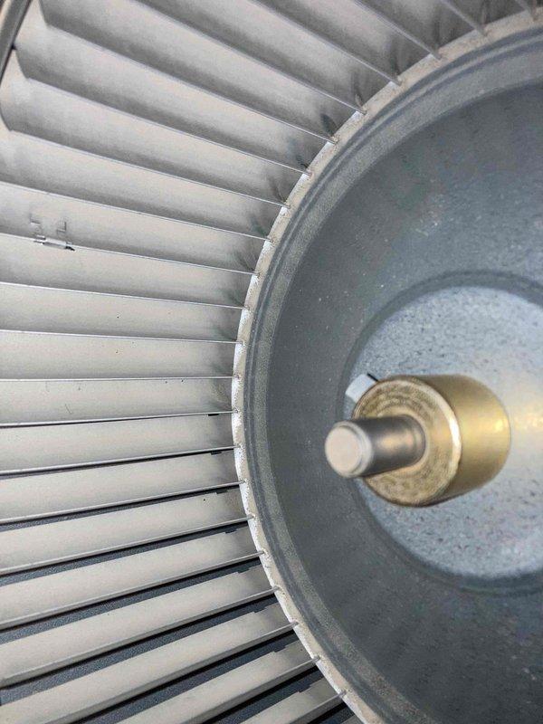 Responded to no cooling complaint on unit under 10 years old. Upon arrival, performed diagnostic testing using digital multimeter to measure electrical parameters and inspected condenser fan motor assembly. Found condenser fan motor operational with proper voltage readings of approximately 5V at temperature sensor connection, and fan blades rotating freely without obstruction or mechanical binding.