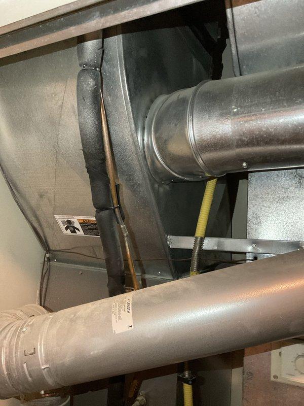Provided comprehensive estimate for complete air conditioning system replacement in condo unit with 15-year-old non-operational equipment. Assessed existing HVAC infrastructure including ductwork, electrical panel capacity, and air handler configuration in utility space showing signs of moisture condensation. Documented current system conditions and discussed replacement options suitable for the property's electrical service and existing duct layout.