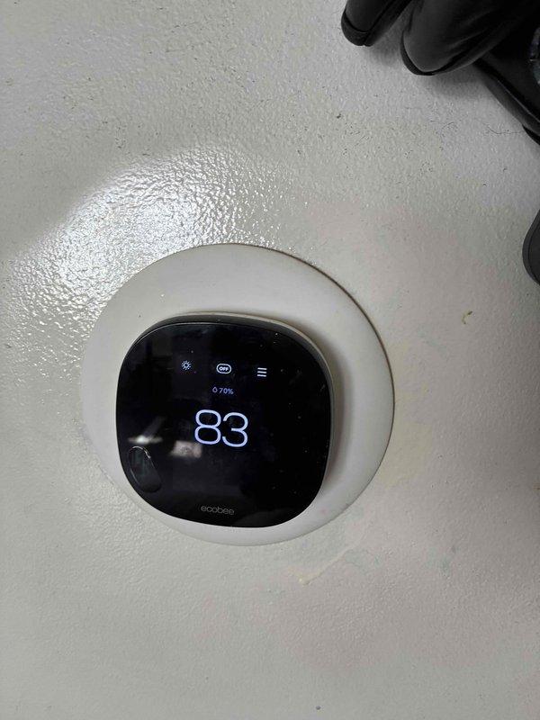 Provided estimate for complete air conditioning system replacement for 12+ year old unit experiencing refrigerant leak. Evaluated existing natural gas furnace and air handler installation in utility closet, assessed current ecobee3 smart thermostat compatibility, and documented existing ductwork configuration to prepare comprehensive replacement proposal for new HVAC system.