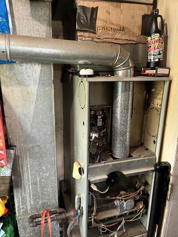 Provided estimate for complete air conditioning system replacement for 12+ year old unit experiencing refrigerant leak. Evaluated existing natural gas furnace and air handler installation in utility closet, assessed current ecobee3 smart thermostat compatibility, and documented existing ductwork configuration to prepare comprehensive replacement proposal for new HVAC system.