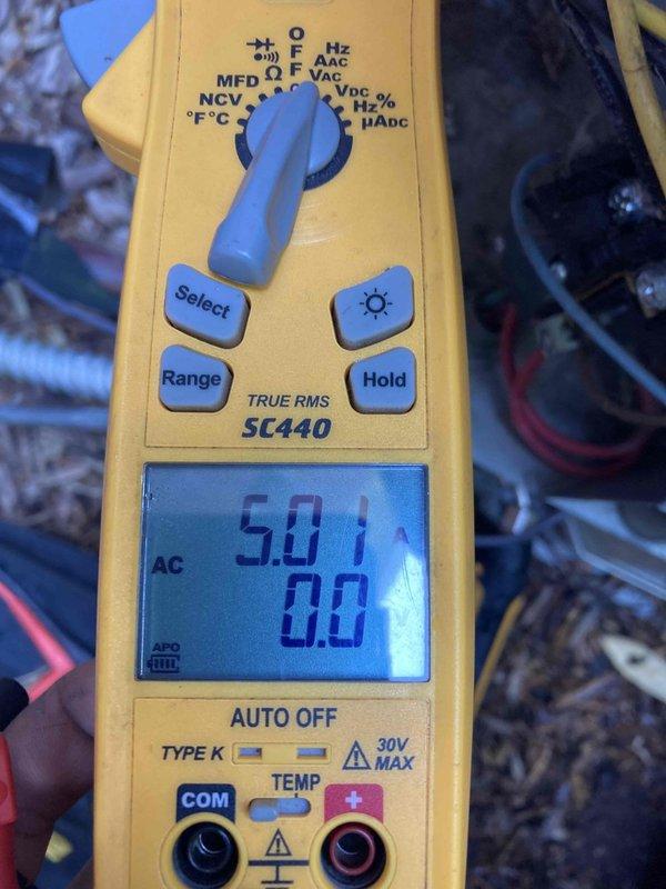 Responded to no cooling complaint on aging air conditioning system. Upon arrival, performed electrical diagnostics using digital multimeter to test capacitor and voltage readings. Measurements indicated capacitor failure with reading of 50.1 MFD and low voltage of 0.624V, preventing compressor from operating properly. Replaced failed dual run capacitor to restore proper system operation and verified all electrical connections were secure and within manufacturer specifications.