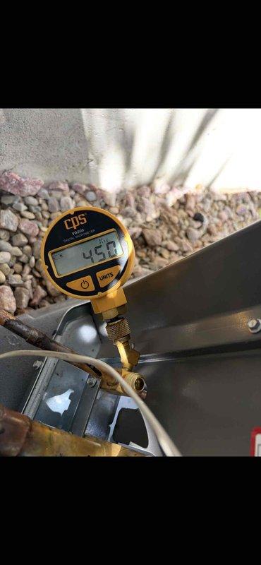 Completed full HVAC system installation including a 70,000 BTU furnace and 3-ton air conditioning unit in the rear yard location. Performed all mechanical and electrical connections, installed condensate drainage piping with proper termination at exterior wall, and reconnected all necessary utilities. Verified system operation with pressure testing showing 424 PSI readings, confirming proper refrigerant charge and system functionality.