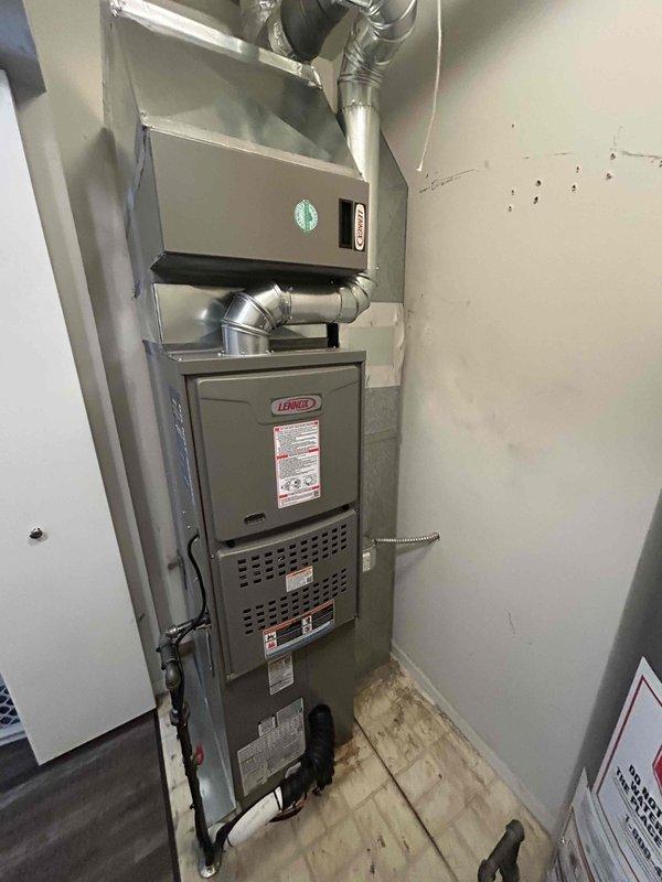 Completed full HVAC system installation including a 90,000 BTU Lennox furnace and 2.5 ton air conditioning unit with evaporator coil. Installed all necessary ductwork with flexible aluminum connections and rigid elbow joints, mounted air filtration system above furnace unit, and established proper electrical and mechanical connections. Positioned outdoor condenser unit in rear yard and reconnected all system components to ensure proper operation. All equipment secured, labeled, and tested for functionality with ventilation system properly integrated into existing infrastructure.