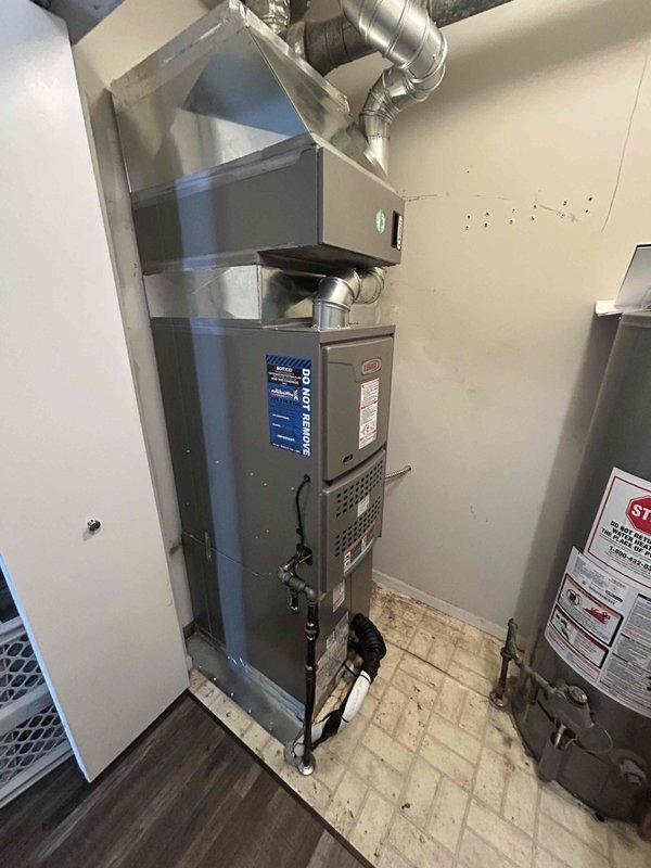 Completed full HVAC system installation including a 90,000 BTU Lennox furnace and 2.5 ton air conditioning unit with evaporator coil. Installed all necessary ductwork with flexible aluminum connections and rigid elbow joints, mounted air filtration system above furnace unit, and established proper electrical and mechanical connections. Positioned outdoor condenser unit in rear yard and reconnected all system components to ensure proper operation. All equipment secured, labeled, and tested for functionality with ventilation system properly integrated into existing infrastructure.