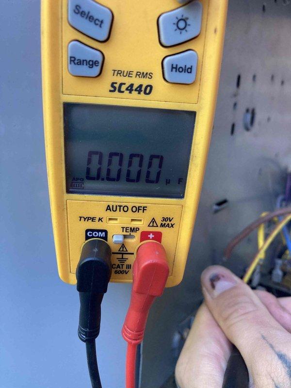 Responded to no cooling call on 10-year-old air conditioning system with non-operational outdoor condenser unit. Upon arrival, performed diagnostic testing using digital multimeter to check electrical components and voltage readings at the condenser. Inspected outdoor unit nameplate specifications to verify proper voltage requirements and equipment ratings. Testing revealed electrical failure preventing condenser from receiving power, resulting in complete loss of cooling capacity.