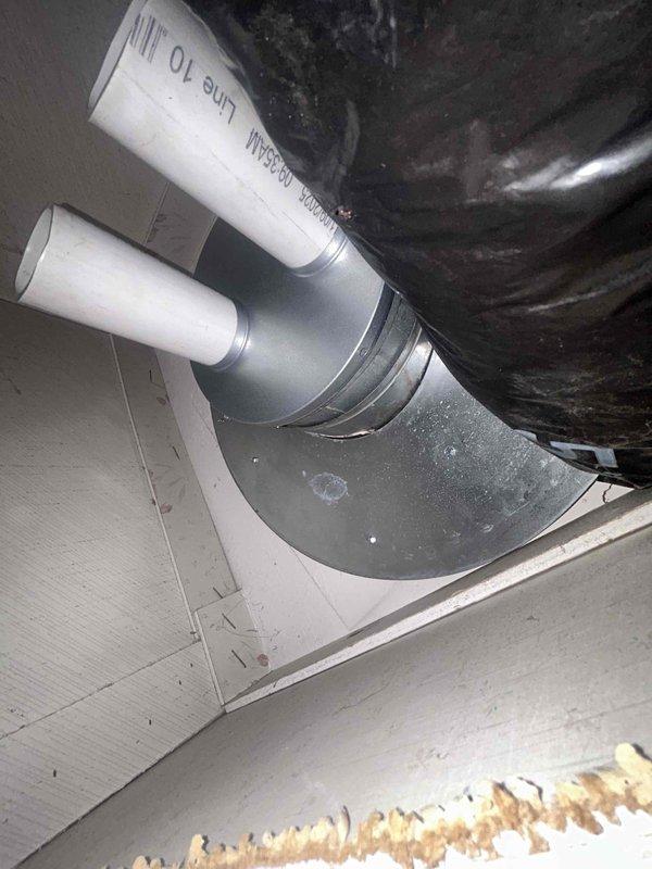 Responded to callback for HVAC installation issue where venting and ceiling area above the furnace coil had a large 8-12 inch opening that required sealing. Inspected the mechanical compartment and ductwork installation in the attic space, documenting the condition of the flex duct connection, metallic transition pieces, and PVC drain lines running through the system. Sealed the gap in the ceiling/venting area above the evaporator coil to prevent air leakage and ensure proper system operation and efficiency.