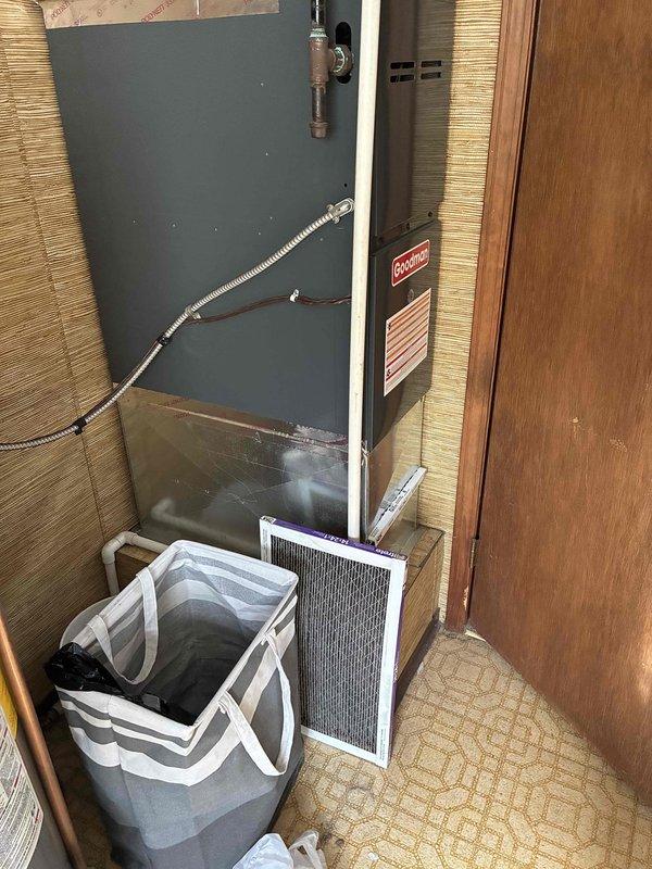 Provided estimate for complete HVAC system replacement on 24-year-old unit deemed unrepairable by utility company. Assessed existing natural gas furnace and air conditioning system located in interior utility closet with vertical installation configuration. Documented current equipment condition and utility room specifications for replacement system sizing and installation planning.