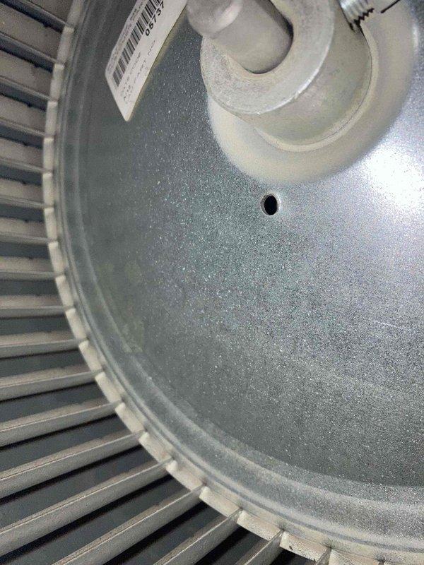 Completed preventive maintenance agreement visit on air conditioning system. Inspected and photographed blower wheel assembly, confirming clean condition with no debris accumulation or blade damage. Performed electrical diagnostics using digital multimeter, recording system amperage at 42.99 amps to verify proper motor operation and system performance within manufacturer specifications.