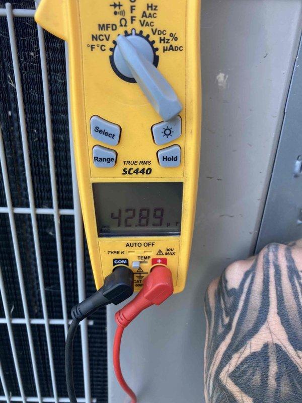 Completed preventive maintenance agreement visit on air conditioning system. Inspected and photographed blower wheel assembly, confirming clean condition with no debris accumulation or blade damage. Performed electrical diagnostics using digital multimeter, recording system amperage at 42.99 amps to verify proper motor operation and system performance within manufacturer specifications.