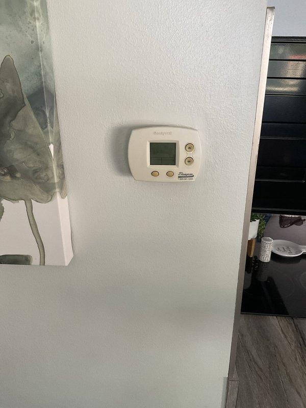 Performed estimate for replacement of non-functional AC unit currently located in flood-prone crawlspace. Assessed existing system configuration including thermostat location, electrical panel capacity, and discussed relocation options with property owner to move equipment to protected area above flood level. Documented current installation conditions and provided recommendations for system replacement with improved placement to prevent future water damage to HVAC equipment.