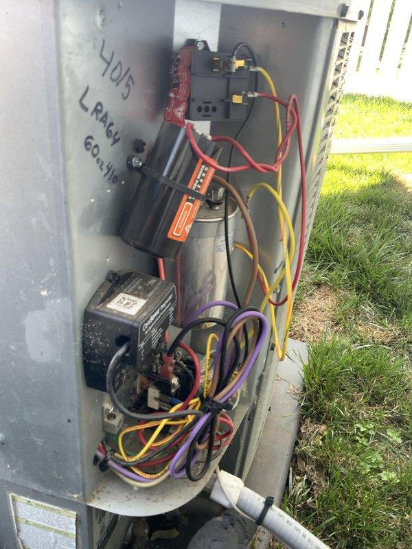 Responded to no-cool condition on 9-year-old Daikin central air conditioning system with compressor not engaging. Upon inspection of outdoor unit, performed electrical diagnostics using multimeter to test capacitor and compressor components. Unit interior showed previous service notation indicating refrigerant leak history. Tested electrical connections, capacitor functionality, and compressor windings to diagnose failure point preventing compressor operation.