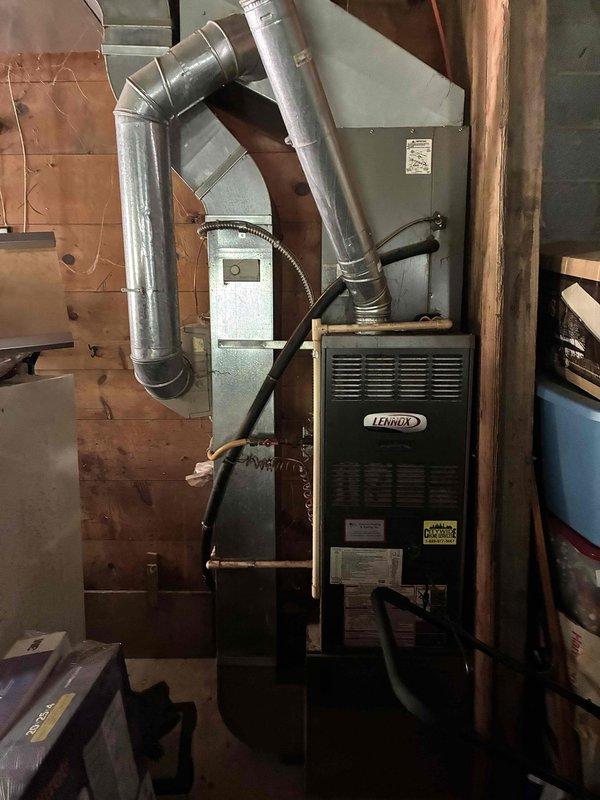 Performed comprehensive evaluation of existing HVAC system for replacement estimate. Outdoor air conditioning unit diagnosed with seized fan motor, failed capacitor, and deteriorated contactor—determined repair costs exceed value of continued service. Indoor Lennox furnace assessed and found to be aging with diminished remaining service life. Documented current equipment conditions through photography and recommended full system replacement with new air conditioning unit and furnace to ensure reliable climate control and energy efficiency.