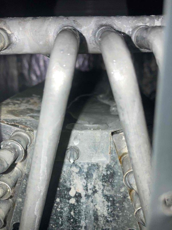 Performed routine maintenance agreement visit for air conditioning system. Replaced defective set screw on gas valve assembly, utilizing easy-out tool to extract damaged original screw before installing new hardware. Conducted electrical diagnostics with multimeter to verify proper system operation and confirm gas valve functionality following repair.