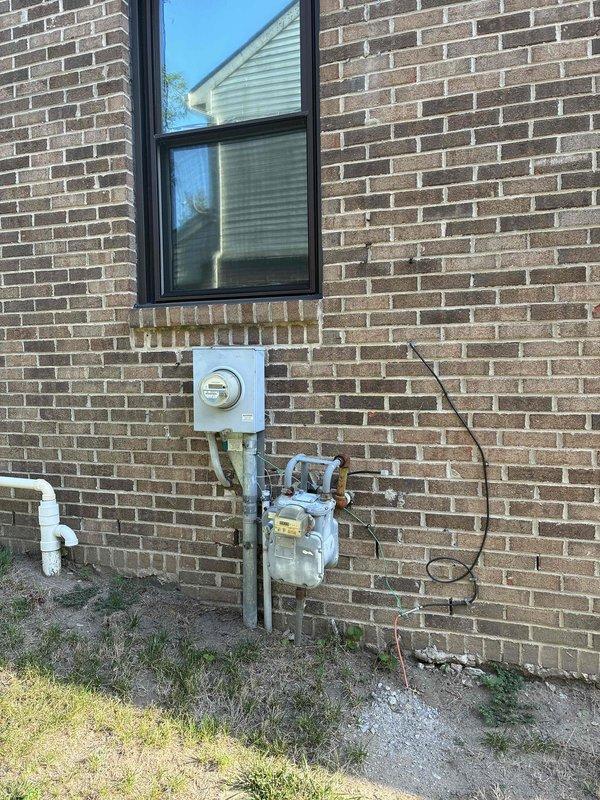 Conducted on-site evaluation for HVAC system replacement at residential property. Assessed existing gas meter installation, utility connections, and electrical panel capacity to determine compatibility requirements for new equipment. Documented current system configuration including gas line routing, electrical service specifications showing dual AC circuits, and exterior mounting locations to provide accurate replacement estimate.