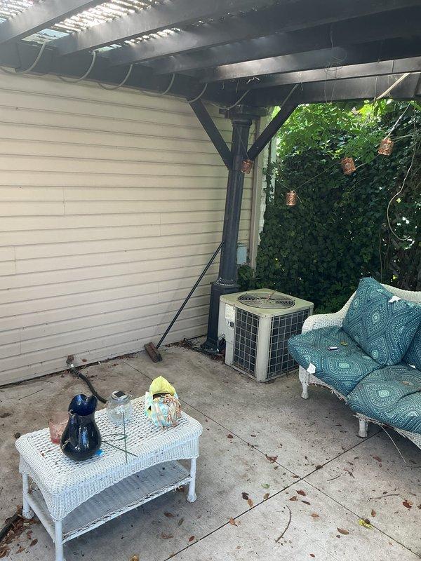 Installed a new GFCI outlet on the outdoor patio area to provide ground fault protection for the exterior living space. The installation ensures safe electrical operation in this weather-exposed environment near the air conditioning unit and outdoor furnishings.