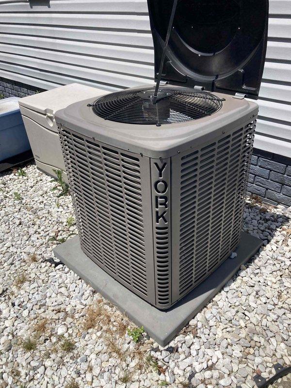 Completed comprehensive air conditioning tune-up on York condensing unit, including inspection of outdoor unit components, verification of proper airflow through louvered panels, and examination of indoor ductwork and insulation systems. All components found operating within normal parameters with no immediate concerns identified. Unit tested and confirmed ready for continued service.