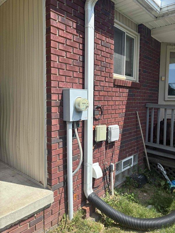 Conducted on-site evaluation for replacement estimate of existing air conditioning system and natural gas furnace that have exceeded their expected service life. Both units are currently operational but require replacement due to age. Documented existing equipment location and exterior utility connections including electrical service and conduit routing for proper sizing and installation planning of new HVAC system.