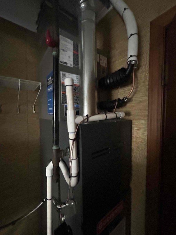 Completed installation of 2-ton air conditioning system with evaporator coil in rear utility closet location. System includes new outdoor condensing unit positioned in backyard area, indoor air handler with coil assembly mounted in mechanical room, and all necessary refrigerant line sets, electrical connections, and condensate drainage piping. All mechanical, electrical, and air conditioning components installed per manufacturer specifications and local code requirements, with system tested and verified operational upon completion.