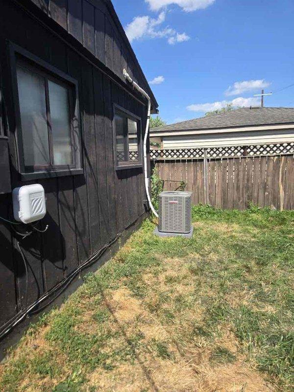 Completed installation of 2-ton air conditioning system with evaporator coil in rear utility closet location. System includes new outdoor condensing unit positioned in backyard area, indoor air handler with coil assembly mounted in mechanical room, and all necessary refrigerant line sets, electrical connections, and condensate drainage piping. All mechanical, electrical, and air conditioning components installed per manufacturer specifications and local code requirements, with system tested and verified operational upon completion.