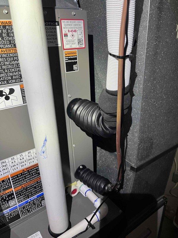 Completed full HVAC system installation including a 70,000 BTU furnace and 2-ton air conditioning unit in utility closet. Performed all mechanical and electrical connections, installed PVC condensate drainage system with proper pitch and routing, ran refrigerant lines with appropriate insulation, and reconnected all existing ductwork. Installed flexible metal conduit for electrical wiring, secured all components per code requirements, applied manufacturer specification labels and service information placards, and verified proper operation of complete system upon startup.