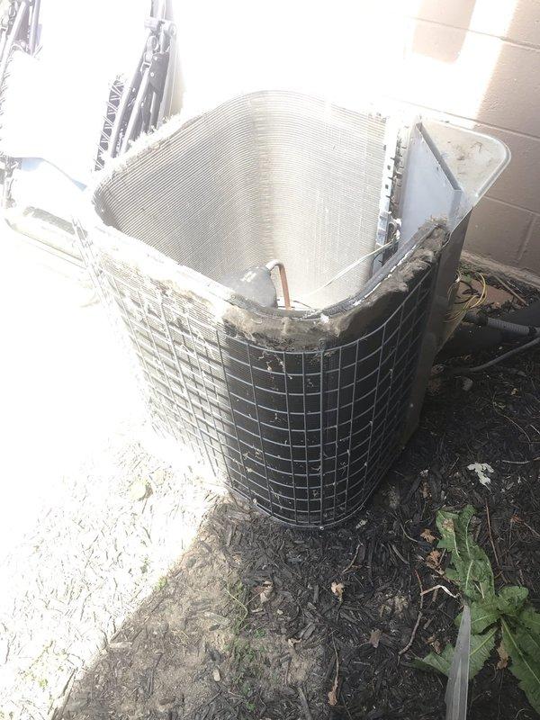 # HVAC Service Report - AC NOT WORKING 12-489

## Summary
Responded to no cooling complaint on 10+ year old air conditioning system. Unit was found with heavily soiled condenser coil restricting airflow and compromising heat transfer efficiency, causing inadequate cooling performance.

## Work Performed

Upon arrival, performed visual inspection of outdoor condensing unit. Found condenser coil completely covered with accumulated dirt, leaves, organic debris, and dust buildup. The heavy contamination was blocking airflow through the aluminum fins and preventing proper heat rejection from the refrigeration system.

Opened top access panel to assess internal condition of condenser coil. Confirmed extensive debris accumulation throughout the coil surface, with multiple areas showing complete blockage between fin spacing. This level of contamination significantly reduces the unit's ability to dissipate heat, resulting in elevated head pressures and reduced system capacity.

Performed thorou