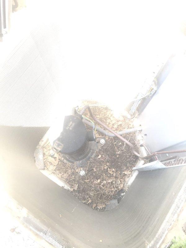 # HVAC Service Report - AC NOT WORKING 12-489

## Summary
Responded to no cooling complaint on 10+ year old air conditioning system. Unit was found with heavily soiled condenser coil restricting airflow and compromising heat transfer efficiency, causing inadequate cooling performance.

## Work Performed

Upon arrival, performed visual inspection of outdoor condensing unit. Found condenser coil completely covered with accumulated dirt, leaves, organic debris, and dust buildup. The heavy contamination was blocking airflow through the aluminum fins and preventing proper heat rejection from the refrigeration system.

Opened top access panel to assess internal condition of condenser coil. Confirmed extensive debris accumulation throughout the coil surface, with multiple areas showing complete blockage between fin spacing. This level of contamination significantly reduces the unit's ability to dissipate heat, resulting in elevated head pressures and reduced system capacity.

Performed thorou