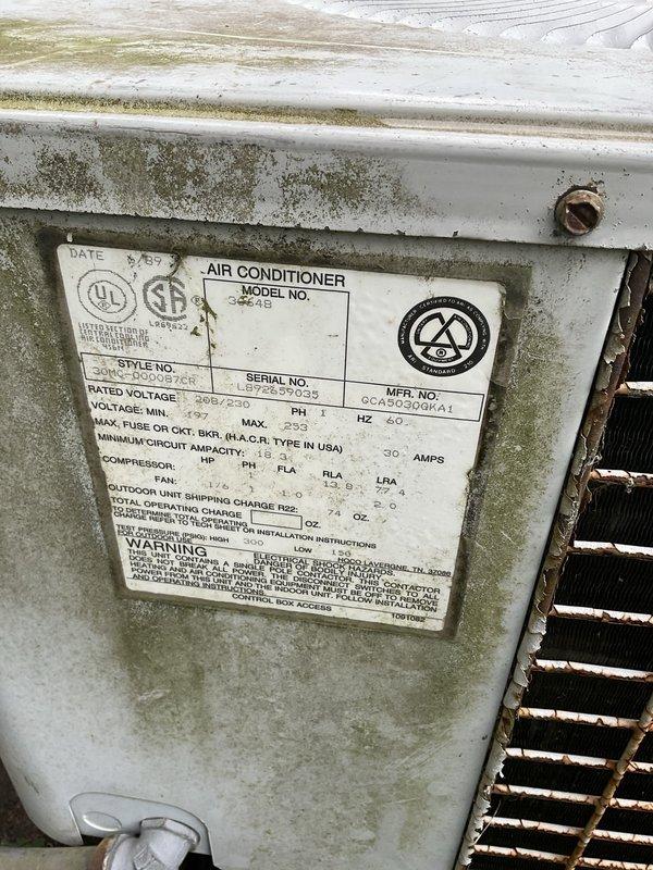 Conducted on-site evaluation of existing outdoor air conditioning unit for replacement estimate. Unit exhibited significant weathering, mold growth, and exterior deterioration consistent with age, with manufacturing date confirmed as August 2013. Documented current system specifications and conditions through photographic assessment to provide accurate replacement recommendations.