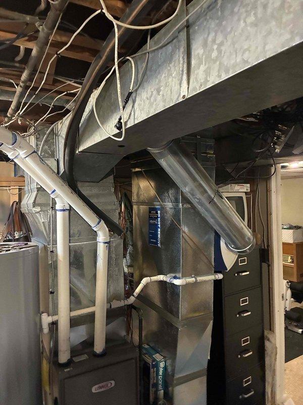 Assessed existing HVAC system in basement utility area and determined fan motor and capacitor had failed. After evaluation, concluded that repair costs would not be economical given the age and condition of the equipment, and provided estimate for complete system replacement.