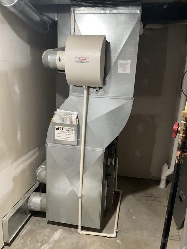 Provided comprehensive estimate for complete HVAC system replacement including furnace and air conditioning unit. Assessed existing 20-year-old furnace and Lennox evaporator coil (Model C33-48C-2F-3) with R-410A refrigerant, along with integrated Honeywell humidifier system. Documented current equipment specifications and installation configuration in basement mechanical room to develop replacement recommendations for proactive system upgrade prior to equipment failure.