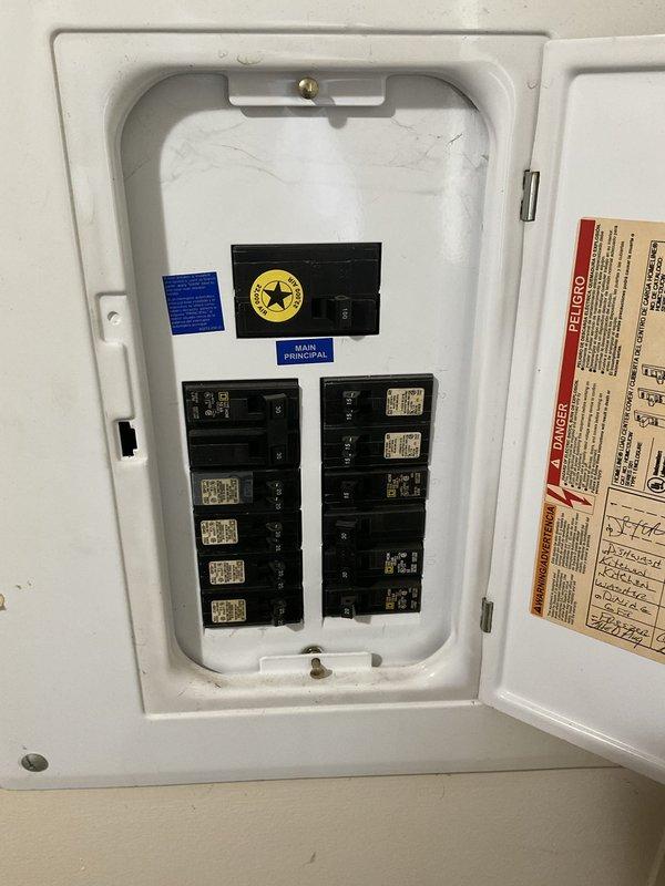 Conducted on-site evaluation of existing air conditioning system for replacement estimate. Current unit is operational but of undetermined older age, located exterior to residence with natural gas furnace inside. Assessed electrical service panel, outdoor condenser unit positioning on concrete pad, disconnect box configuration, and existing refrigerant line routing to provide comprehensive replacement system recommendations.