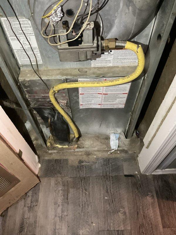 Evaluated non-functional aging HVAC system for replacement. Documented existing furnace installation with flexible gas line connections, electrical wiring, and air handler configuration in mechanical closet. Assessed current LUX thermostat displaying system status. Provided comprehensive replacement estimate for complete system upgrade to restore heating and cooling functionality.