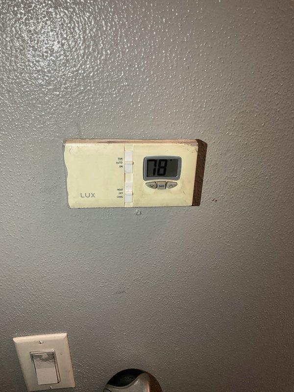 Evaluated non-functional aging HVAC system for replacement. Documented existing furnace installation with flexible gas line connections, electrical wiring, and air handler configuration in mechanical closet. Assessed current LUX thermostat displaying system status. Provided comprehensive replacement estimate for complete system upgrade to restore heating and cooling functionality.