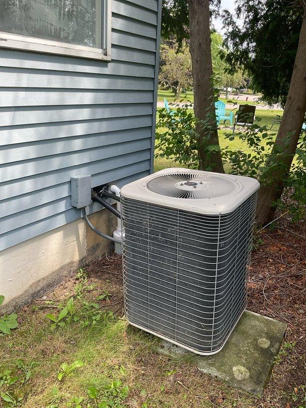 Conducted on-site evaluation for complete HVAC system replacement including 10-year-old furnace located in basement and 20-year-old air conditioning unit positioned on exterior concrete pad. Both units currently operational but nearing end of service life. Documented existing equipment configuration, photographed outdoor condenser unit with connected refrigerant lines and electrical conduit, assessed gas meter location and utility connections for furnace replacement planning. Provided comprehensive replacement estimate featuring mid-range equipment options suitable for home preparation prior to sale.