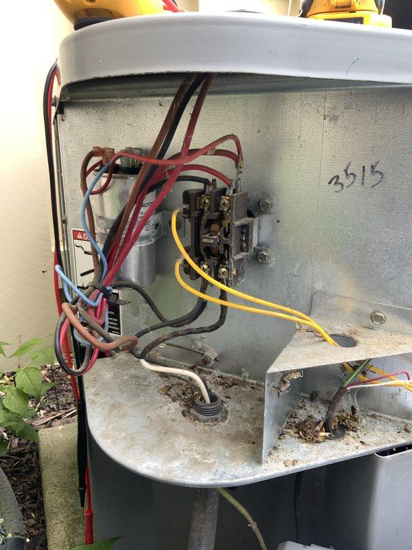 Responded to no cooling call on 21-year-old air conditioning system with indoor temperature at 85°F. Upon arrival, confirmed furnace and blower motor operational and thermostat functioning properly with fresh batteries installed. Inspected outdoor condensing unit and found significant debris accumulation in base including leaves, dirt, and organic matter. Opened electrical compartment and performed visual inspection of contactor, capacitor, control board, and all electrical connections. Assessed wiring condition on 21-year-old system, noting multiple wire connections to capacitor and control components. Documented internal electrical components and overall system condition with photos. Based on age of equipment and operational assessment, provided recommendations for system replacement due to unit exceeding typical service life expectancy. Discussed repair versus replacement options given the advanced age of both the air conditioning and furnace systems.