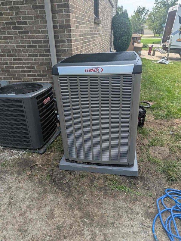 Completed full HVAC system installation including a 70,000 BTU Lennox furnace, 3-ton Lennox air conditioning unit, and humidifier system. The outdoor AC unit was positioned on a concrete pad in the rear yard with proper electrical conduit installation and connection. Interior mechanical components were installed in the utility area with all necessary plumbing connections, PVC venting, and copper supply lines properly configured. All equipment was reconnected, tested for proper operation, and system commissioning was successfully completed.
