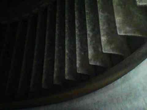 Completed preventive maintenance inspection on air conditioning system under Club AC8-12 agreement. Inspected evaporator coil and found moderate accumulation of dust and debris on fins, with visible oxidation and discoloration indicating extended service period. Examined ductwork connections in confined access area, noting dust buildup on metallic surfaces and joint connections. Documented system condition with photos for maintenance records. Unit operational at time of inspection.