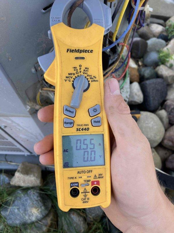 Completed routine maintenance agreement visit for air conditioning and system inspection. Performed electrical diagnostics using clamp meter, recording amperage readings of 0.55 amps on system components. Inspected outdoor HVAC unit and associated wiring connections to verify proper operation and electrical performance within manufacturer specifications.