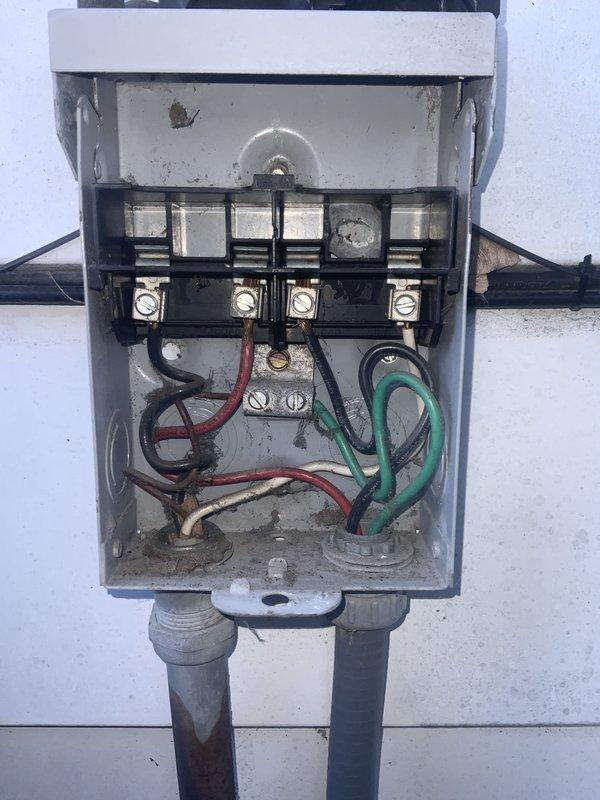 # HVAC Service Report: No Cool - Aged System

Responded to service call for 23-year-old air conditioning system with reported condenser fan motor malfunction and diminished cooling capacity. Upon arrival, performed visual inspection of outdoor condensing unit and verified fan motor was operating intermittently with reduced RPM. Opened electrical disconnect box and inspected internal components, noting significant age-related deterioration including corroded terminals, accumulated debris, and weathered wiring connections.

Tested voltage at disconnect and contactor, confirming power supply to unit. Removed access panel on condensing unit to examine dual capacitor, contactor assembly, and associated wiring harness. Measured capacitance values on run capacitor serving both compressor and fan motor circuits, finding fan motor capacitor section reading below manufacturer specifications. Inspected contactor contacts for pitting and proper closure during operation.

Performed amp draw test on