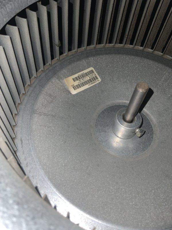 Responded to no cooling call on 20-year-old central air conditioning system. Upon inspection, found blower motor assembly with signs of wear and control board with multiple wire connections to capacitor and electronic components. Documented system conditions with photos of blower wheel assembly and main control board for diagnostic purposes.