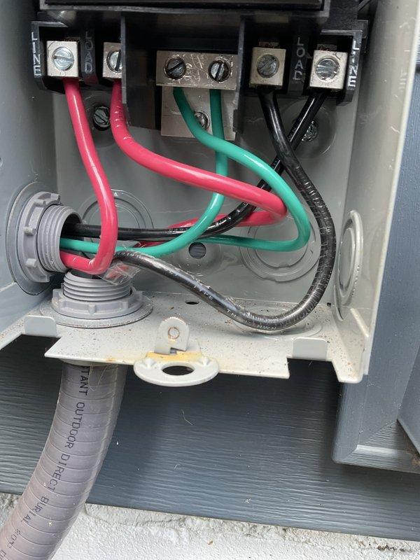 Completed warranty service for control board replacement on outdoor HVAC unit. Replaced defective circuit board 2-6 within the multi-board electronic control system, verified proper wiring connections at terminal block including hot conductors and ground wire, and confirmed all ribbon cable connections and conduit fittings were secure. Unit tested successfully with all electronic components functioning properly upon completion.