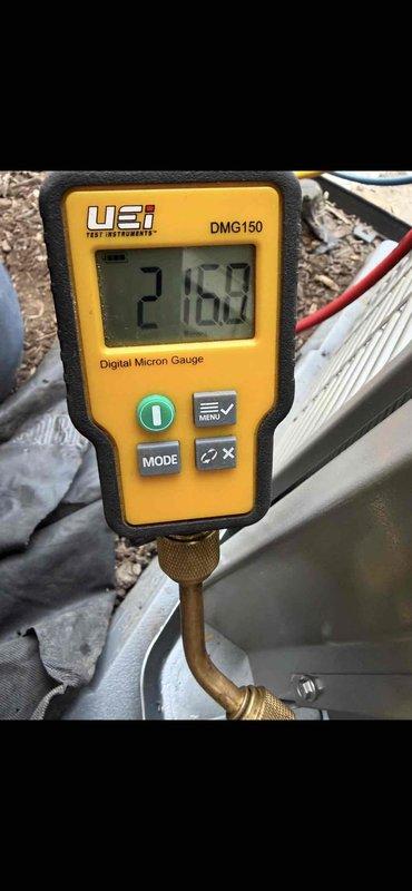 Responded to system startup callback after power restoration. Verified system operation and performed vacuum test on refrigeration lines, achieving micron reading of 2162 on digital gauge. Completed installation of Lennox smart thermostat and confirmed proper mounting and display functionality.