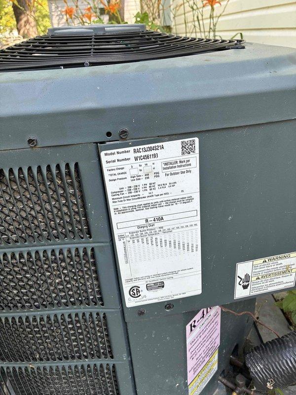 Conducted comprehensive on-site evaluation for complete HVAC system replacement including outdoor condensing unit (Model RAC1830A0621A) and indoor furnace with air handler assembly. Documented existing equipment specifications, photographed current installation including R-410A rated outdoor unit and indoor heating/cooling components with ductwork connections. Provided detailed system replacement estimate incorporating water heater options for integrated home comfort solution.