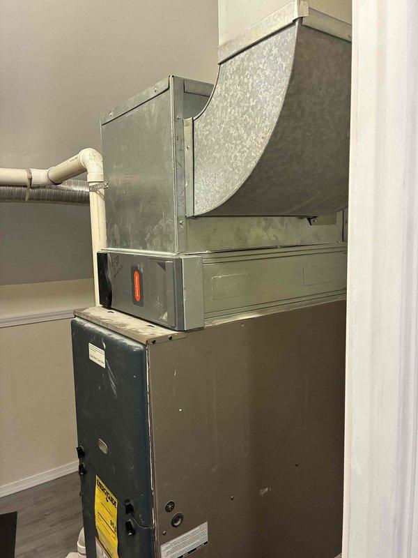 Conducted comprehensive on-site evaluation for complete HVAC system replacement including outdoor condensing unit (Model RAC1830A0621A) and indoor furnace with air handler assembly. Documented existing equipment specifications, photographed current installation including R-410A rated outdoor unit and indoor heating/cooling components with ductwork connections. Provided detailed system replacement estimate incorporating water heater options for integrated home comfort solution.