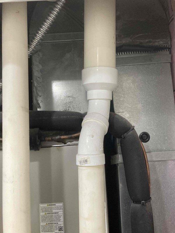 Completed AC CLUB 12-4 preventive maintenance agreement visit. Performed comprehensive inspection of air conditioning system and supplemental items, including examination of drain pan condition, condensate drainage system with PVC piping, flexible ductwork connections, and air handler components. All system components were inspected and photographed for documentation purposes, with drain pan showing normal condensation levels and all piping connections secure and functioning properly.