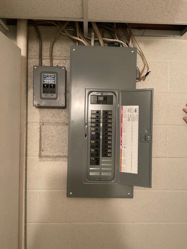 Completed electrical estimate for new whole home generator installation at manufactured home. Assessed existing electrical panel configuration and available space for transfer switch integration. Documented current kitchen electrical load including electric range and microwave to determine generator capacity requirements and proper load management for automatic transfer switch installation.