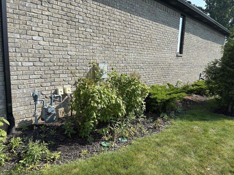 Completed electrical estimate for new whole home generator installation at residential property. Assessed exterior installation location adjacent to existing utility meter on brick wall, evaluated landscaping considerations, and determined optimal placement for generator unit. Reviewed interior electrical infrastructure including main service panel, gas line routing, and transfer switch installation requirements to ensure proper integration with home's electrical system.