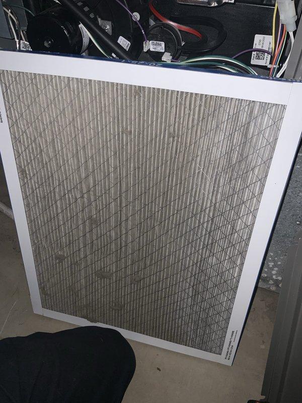 # AC Not Turning On After Power Outage

Responded to no-cooling call following power outage. Upon arrival, found outdoor condensing unit not energizing. Removed access panel and inspected electrical components. Located failed dual run capacitor preventing compressor and condenser fan motor operation. Capacitor showed visible signs of failure and tested out of specification with multimeter. 

Replaced defective capacitor with manufacturer-approved replacement matching correct microfarad and voltage ratings. Verified all electrical connections secure and properly terminated. Restored power and tested system operation. Confirmed compressor and condenser fan motor engaging properly with correct amperage draw on both circuits.

Proceeded to indoor air handler for routine inspection during service call. Removed and inspected air filter, which showed moderate dust accumulation. Checked blower motor operation and verified proper airflow through evaporator coil. All indoor components functionin