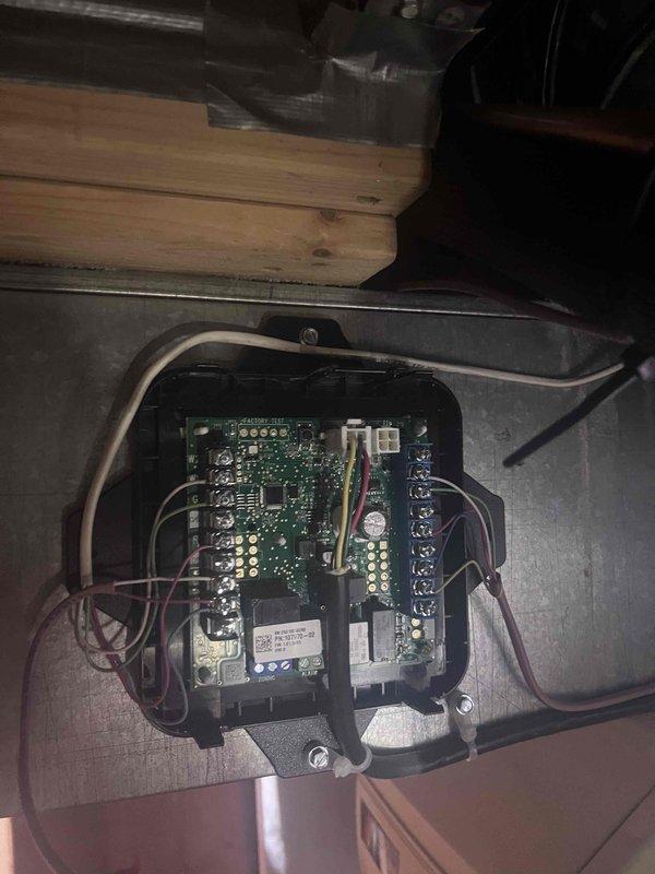 Responded to callback for air conditioning system not operating following power outage. Upon arrival, accessed control board assembly in mechanical space and performed diagnostic inspection. Found control board had experienced power surge damage during outage, preventing system operation. Inspected all wire connections, terminal blocks, and electronic components on circuit board for visible damage or loose connections. Verified proper voltage at incoming power supply and confirmed board failure as root cause of system malfunction. Documented control board condition with photographs showing internal circuitry, component layout, and wiring connections for warranty and service records.